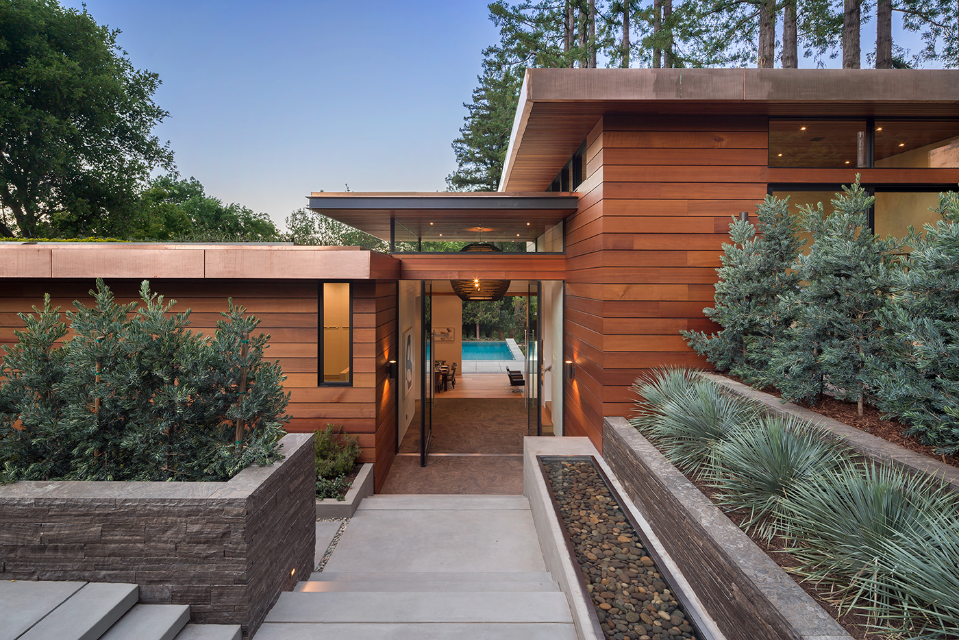 Cedar-clad entry with full-height glazing